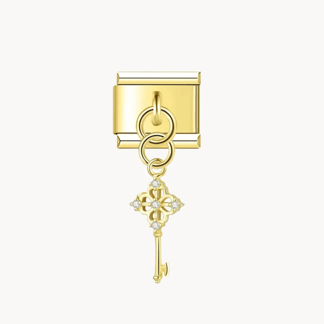 Pendentif clef brillante dorée